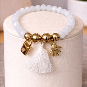 Crystal tassel and charm bracelet
